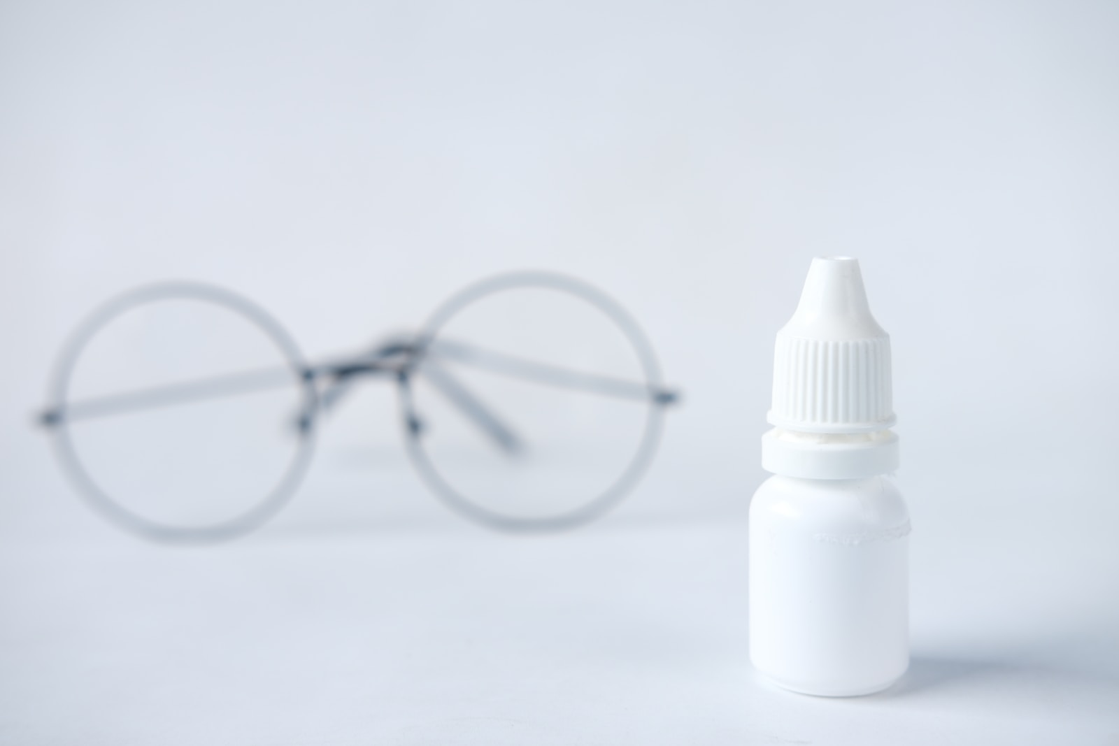 white plastic bottle with white cap